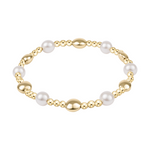Stretch bracelet with gold beads and white pearls