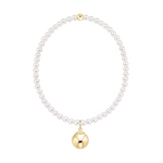 Pearl necklace with a gold bead and a gold sphere pendant