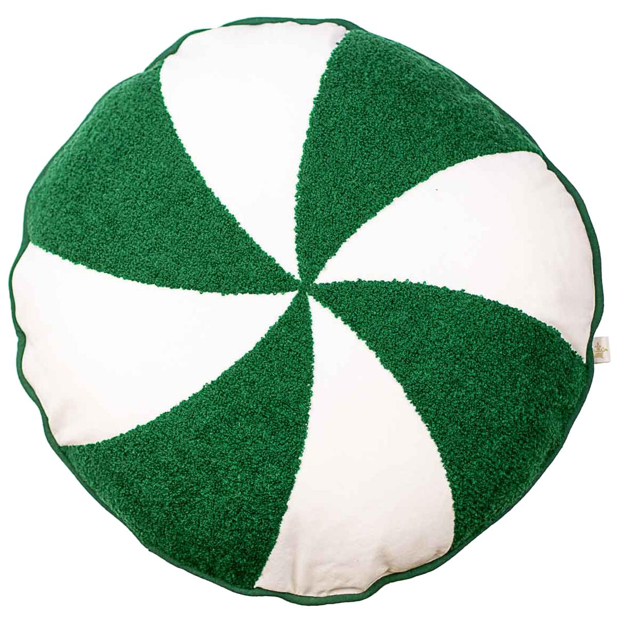 Textile round cushion featuring a vibrant green and white pinwheel swirl pattern with a textured terry cloth finish