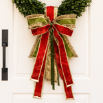Bow of red velvet with gold edges, olive green velvet and gold brocade ribbons on a boxwood wreath