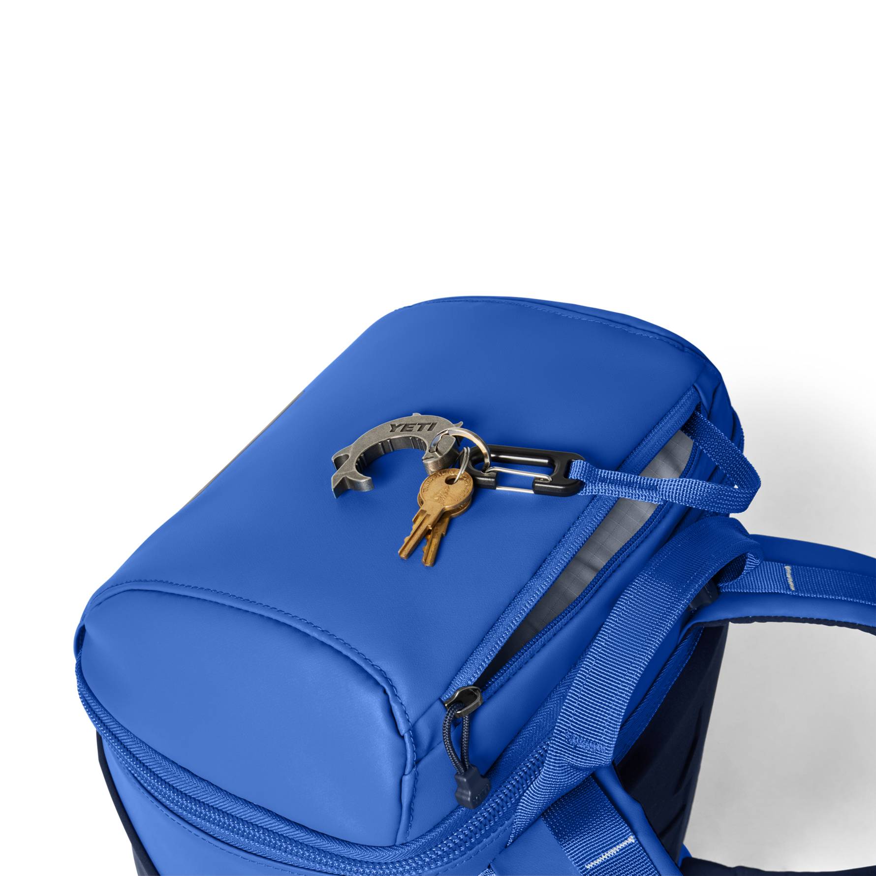 Blue backpack with keys attached on a white background