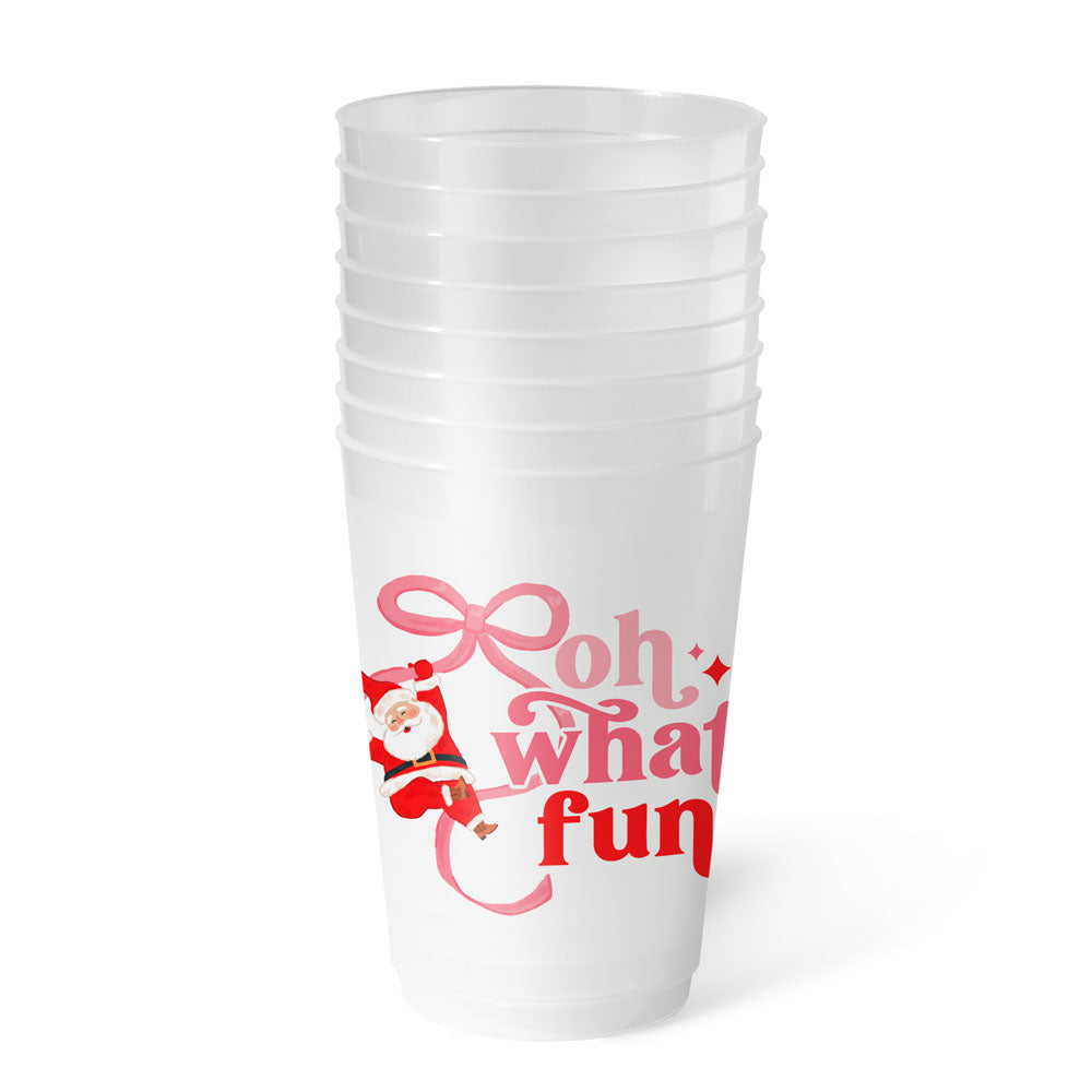 Stack of frosted party cups printed "oh what fun" with Santa swinging on a pink ribbon