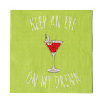 Lime green cocktail napkin reading "Keep an eye on my drink" with a red martini and eyeball garnish