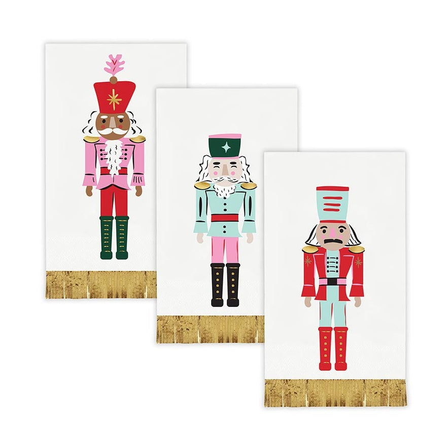 Three nutcracker guest napkins with gold foil fringe
