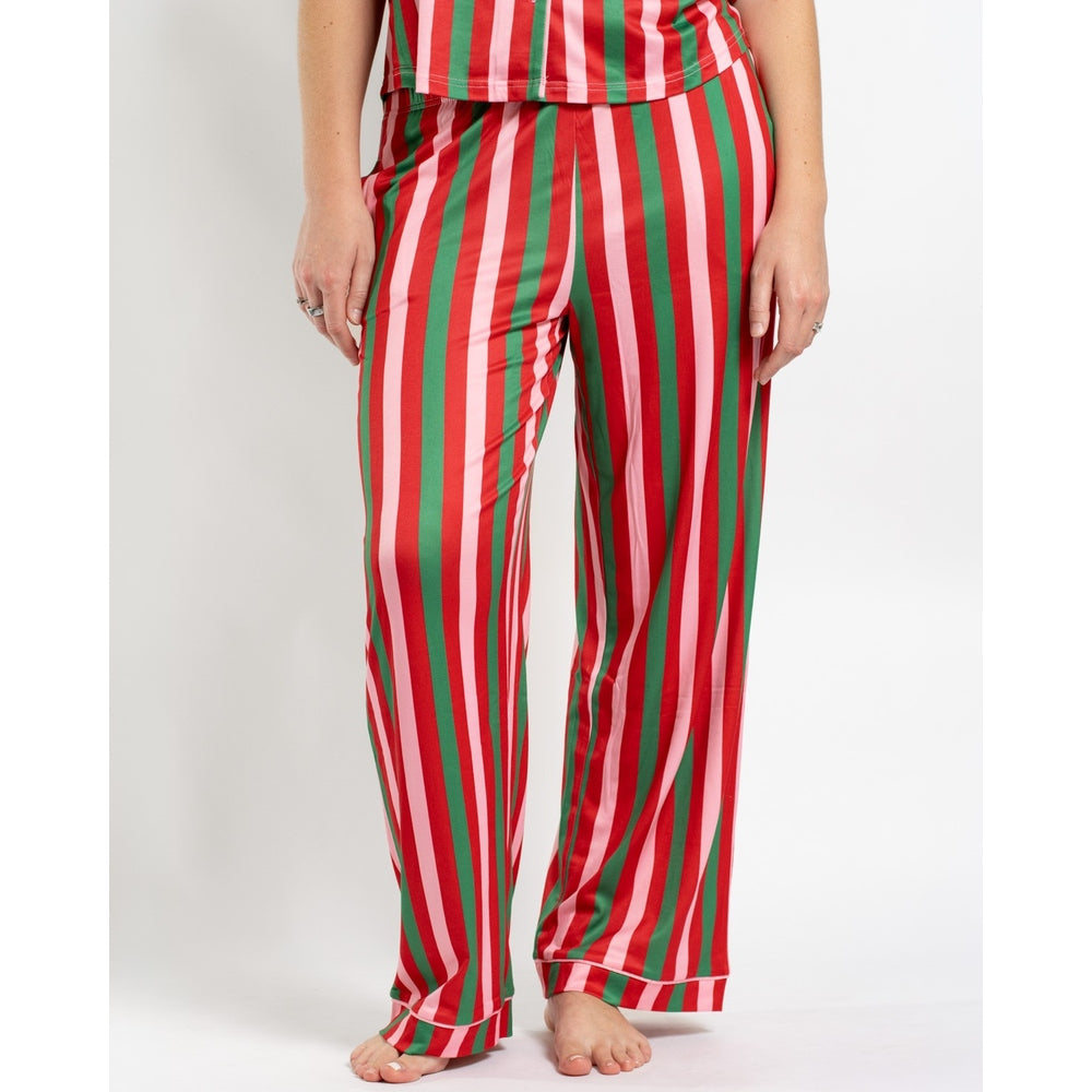 Person wearing red green and pink striped pajama pants