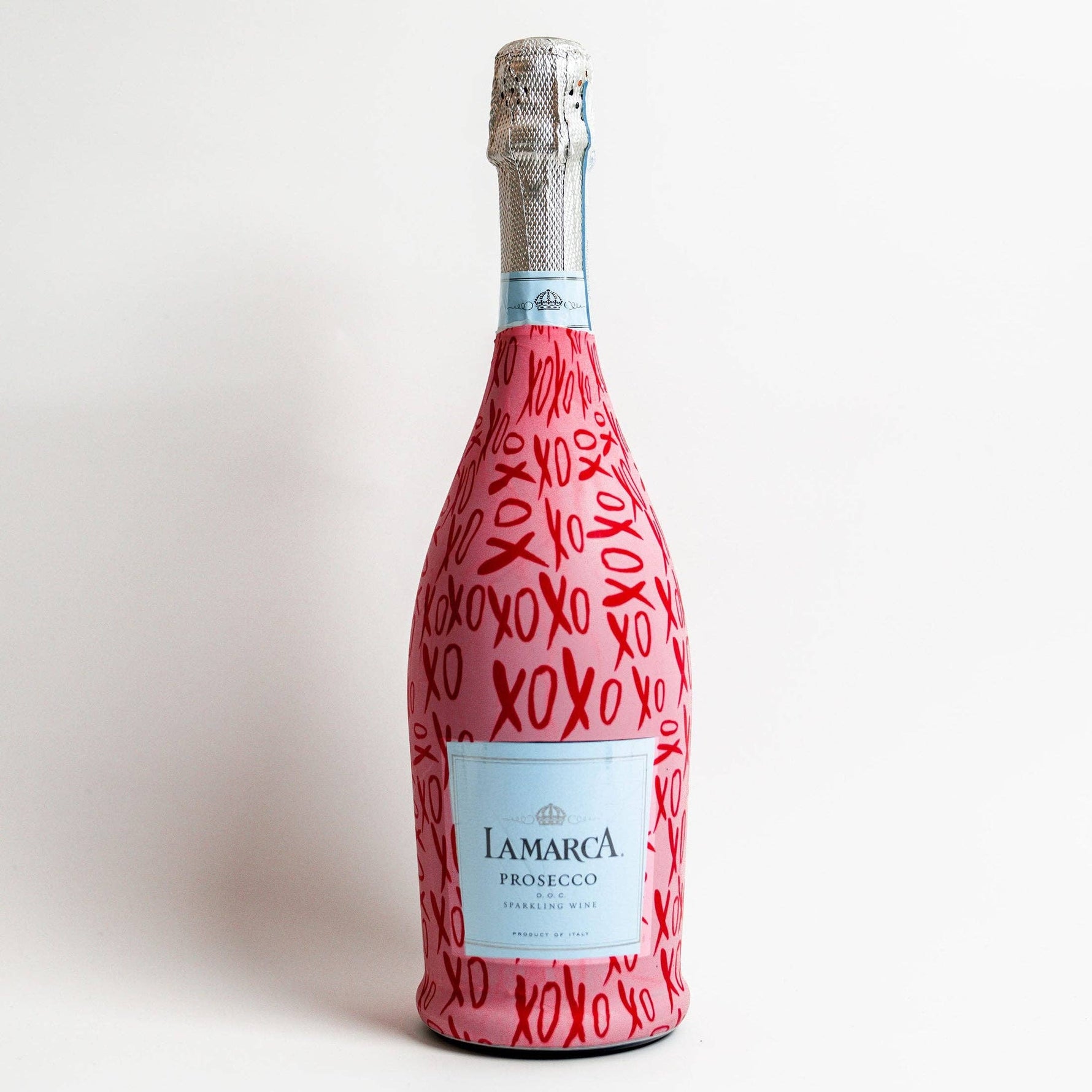 Bottle of Lamarca Prosecco with a red pattern on a white background