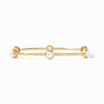 Gold bangle bracelet with three round white pearls