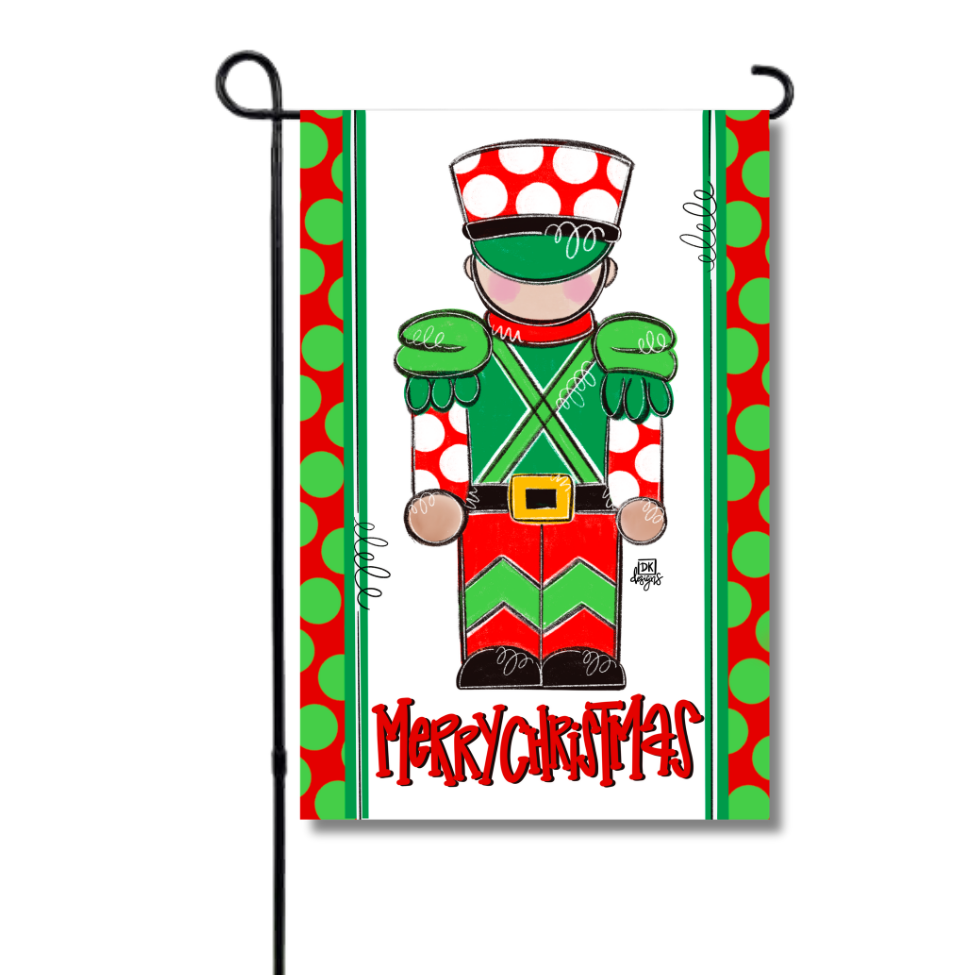 Merry Christmas garden flag with a red and green toy soldier