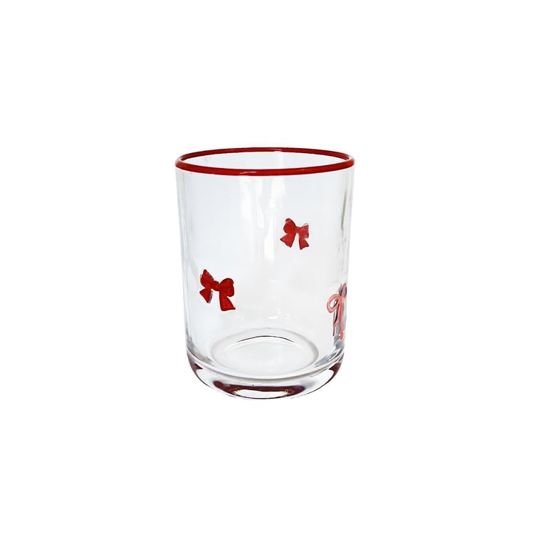 Clear glass tumbler with small red bows and a red rim