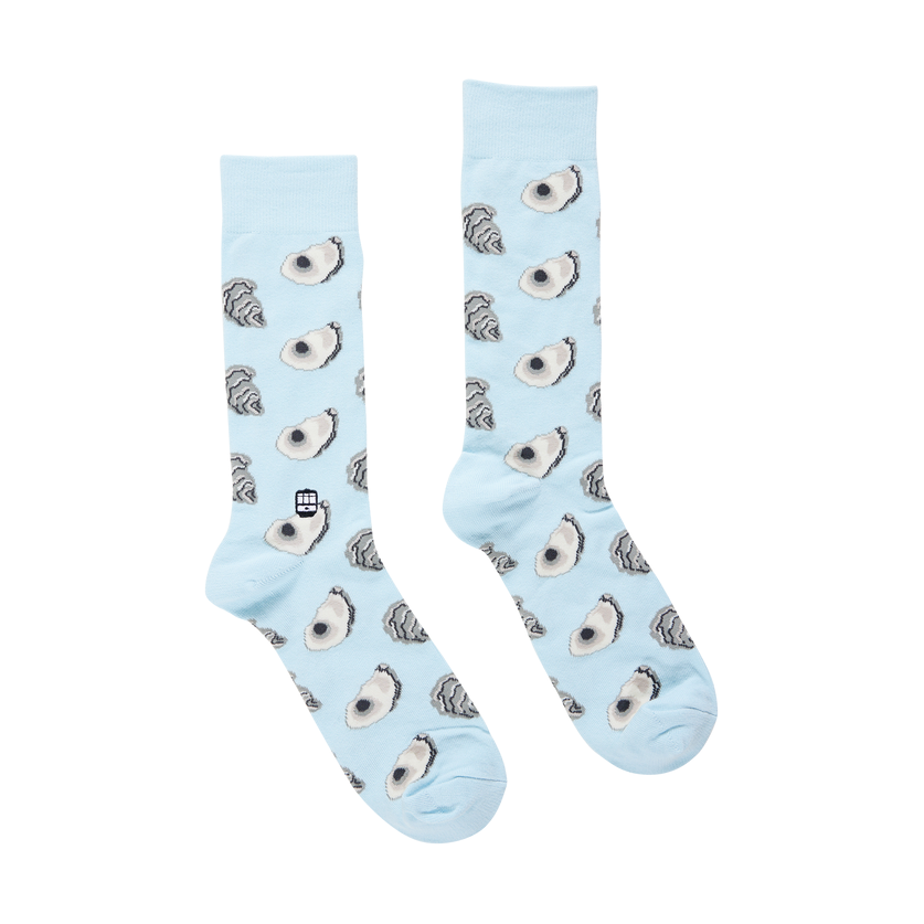 Light blue crew socks with an oyster pattern and a small cable car icon