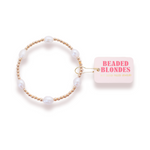 Pearl bracelet with gold accents and a 'Beaded Blondes' box on a white background