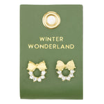 Gold wreath stud earrings with crystals and cream bows on a green card reading "Winter Wonderland"