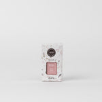 Studio photograph for Bridgewater Candle Company of a Sweet Grace fragrance refill box on a plain white background featuring pink stone-like patterns, the Pura logo, and a pink label