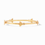 Gold bangle bracelet featuring small bee motifs