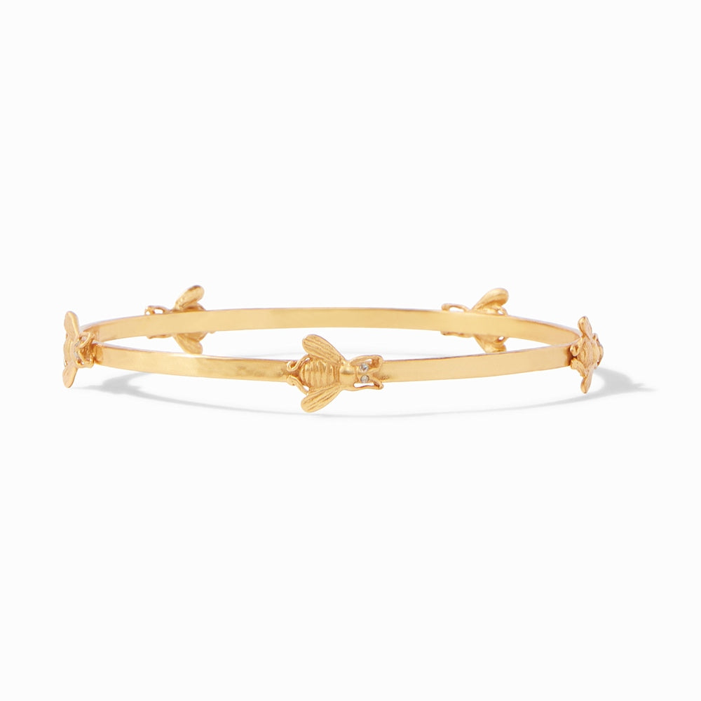 Gold bangle bracelet featuring small bee motifs