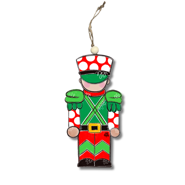 Acrylic toy soldier ornament with red polka dot hat, green jacket and red and green chevron pants
