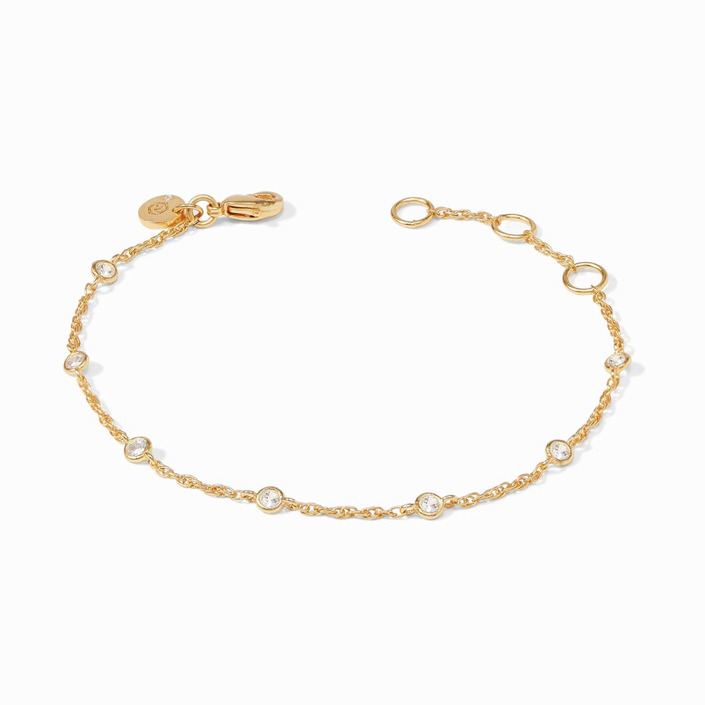 Gold chain bracelet with evenly spaced round clear stones and a lobster clasp