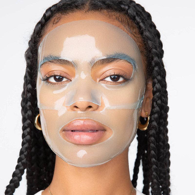 Person with braided hair wearing a clear hydrogel face mask