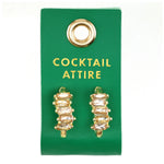 Gold crystal cluster earrings on a green Cocktail Attire card