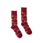 Pair of red crew socks featuring a repeating pattern of musical instruments and piano keys