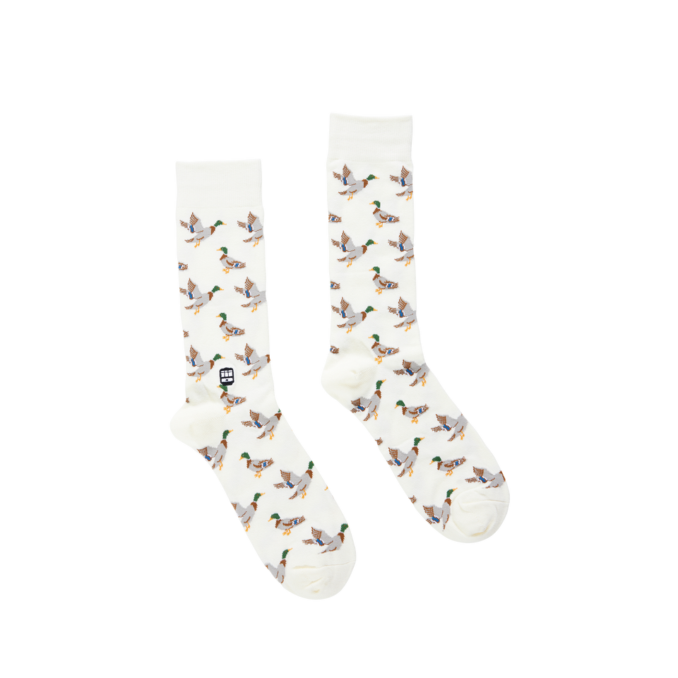 Pair of white crew socks with a repeating mallard duck pattern