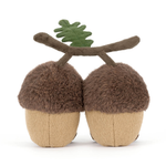 Back view of a stuffed acorn toy with a branch on a white background