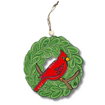 Acrylic ornament of a red cardinal perched inside a green leafy wreath