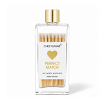 Chez Gagné glass bottle of white-tipped matches with gold cap, gold heart and "Perfect Match" label