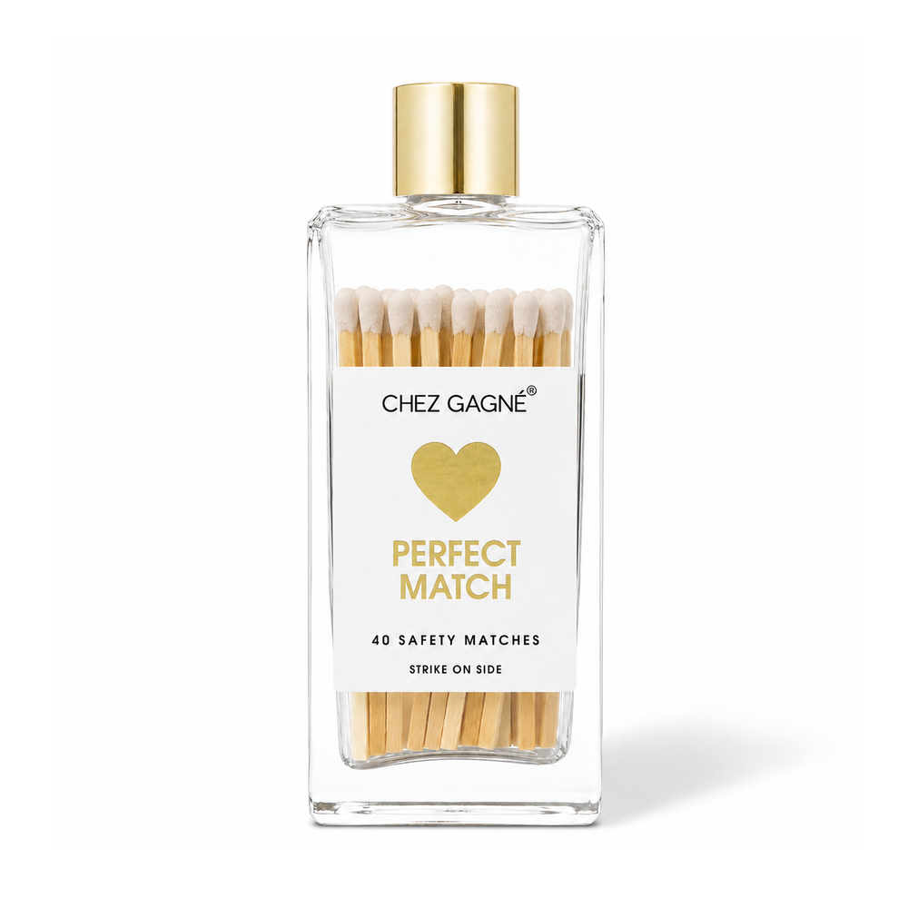 Chez Gagné glass bottle of white-tipped matches with gold cap, gold heart and "Perfect Match" label