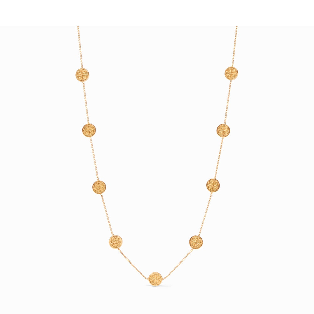 Gold chain necklace featuring evenly spaced circular coin charms with embossed cross designs