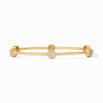 Gold bangle bracelet with four circular stations featuring pave set white stones