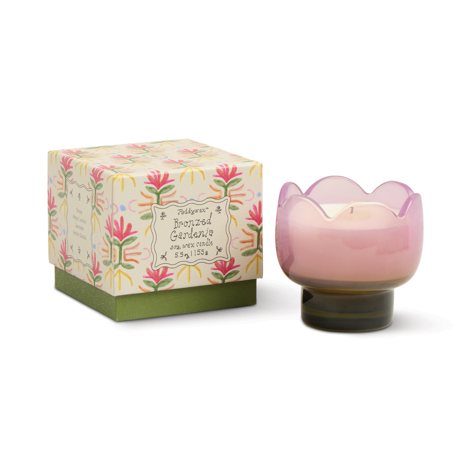 Pink tulip shaped candle in a decorative holder with a matching floral box on a white background