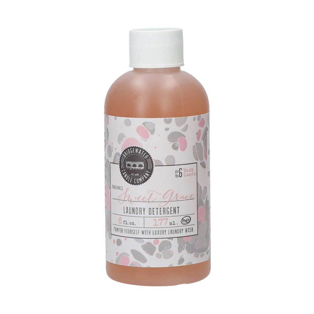 A 6oz bottle of Sweet Grace laundry detergent with a label featuring the product name and a floral pattern.