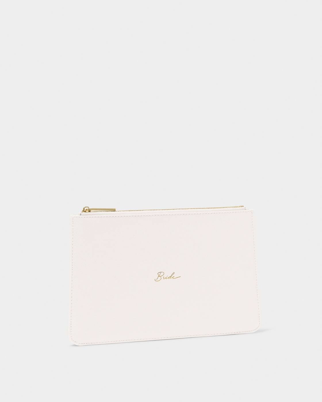 Product photograph of a Katie Loxton vegan leather clutch for a wedding bride featuring an elegant gold cursive Bride script, a shimmering gold-tone zipper, and a textured cream finish on a clean white studio background