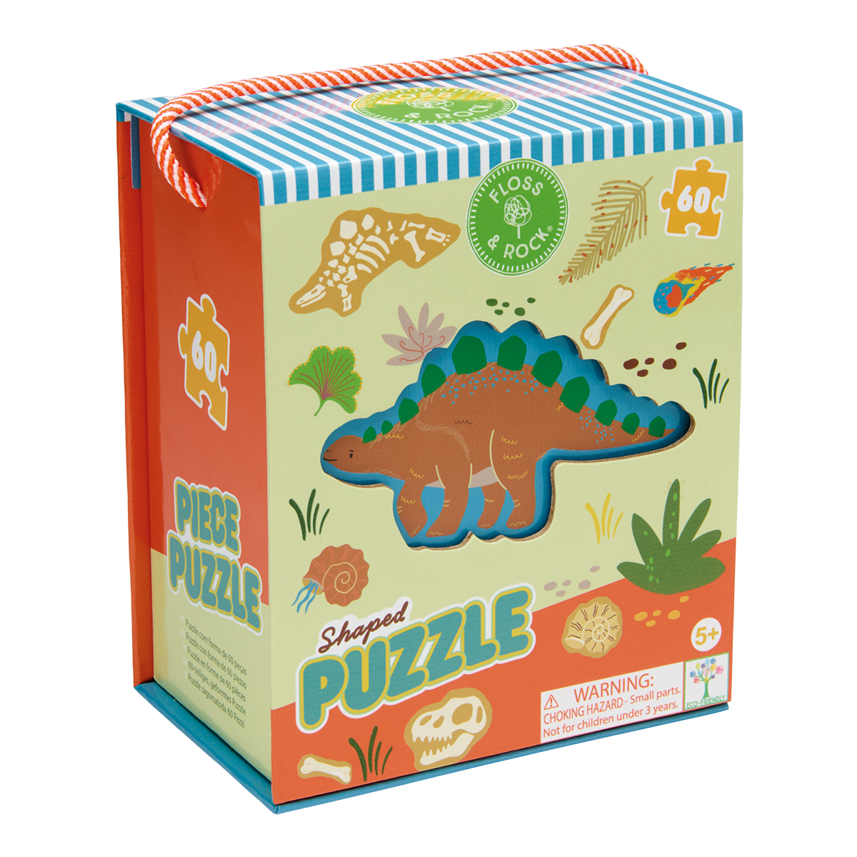 Illustrated puzzle packaging by Floss & Rock depicting a 60-piece stegosaurus shaped puzzle in a prehistoric scene with a fiery meteor, beige dinosaur fossils, and an orange and white striped rope handle