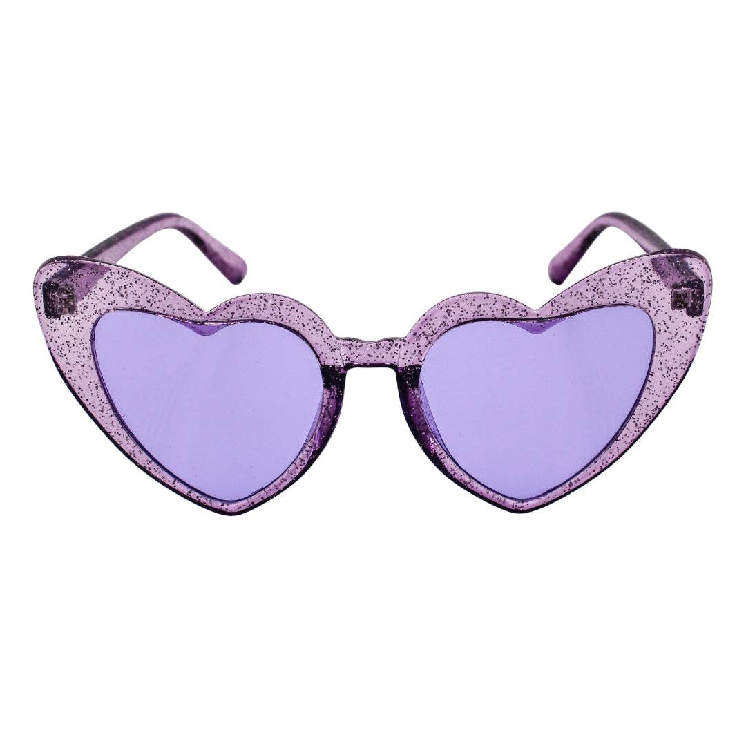 Heart-shaped sunglasses with purple glitter frames and lenses on a white background