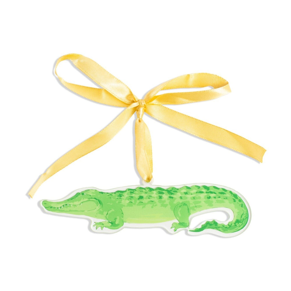 Green alligator acrylic ornament with a yellow ribbon