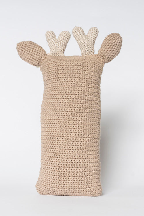 Crocheted yarn deer plush toy featuring a light tan body two cream-colored antlers and small rounded ears on a simple white studio background