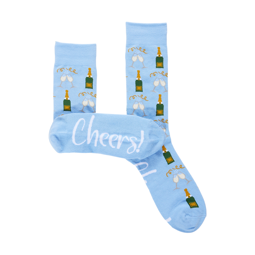 Light blue crew socks with champagne bottle and glass pattern and Cheers text on the sole