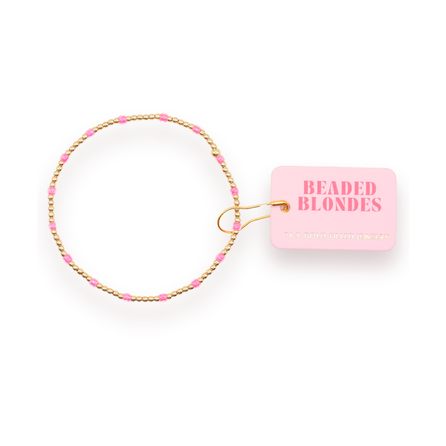 Beaded hair tie with pink beads and gold accents on a white background, featuring 'Beaded Blondes' packaging.