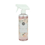 A clear spray bottle labeled 'Multi-Surface Cleaner' with a floral pattern and a white spray nozzle, containing a pink liquid.
