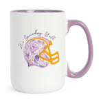 White mug with a purple handle and a football helmet design