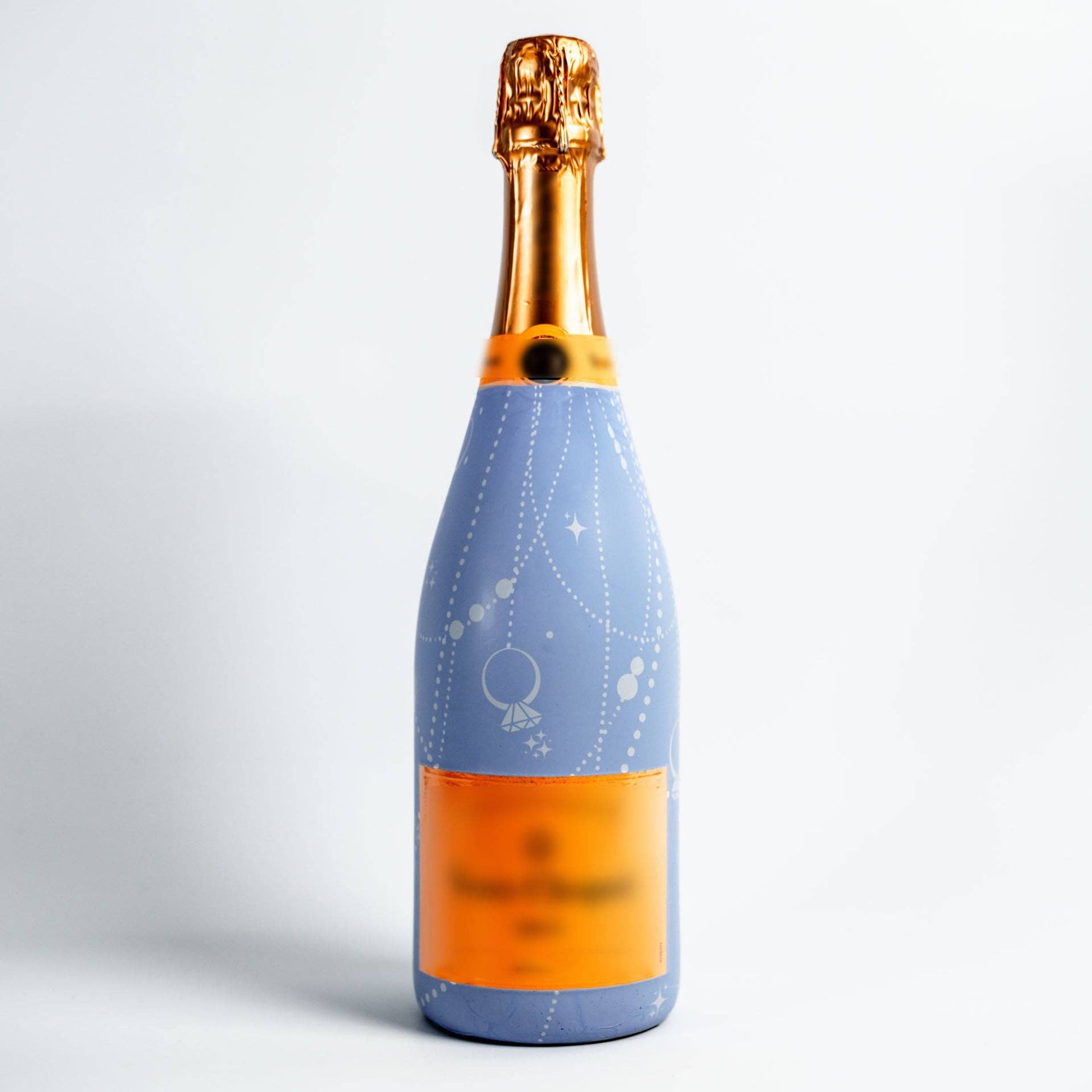Bottle with a blue label and gold cap on a white background