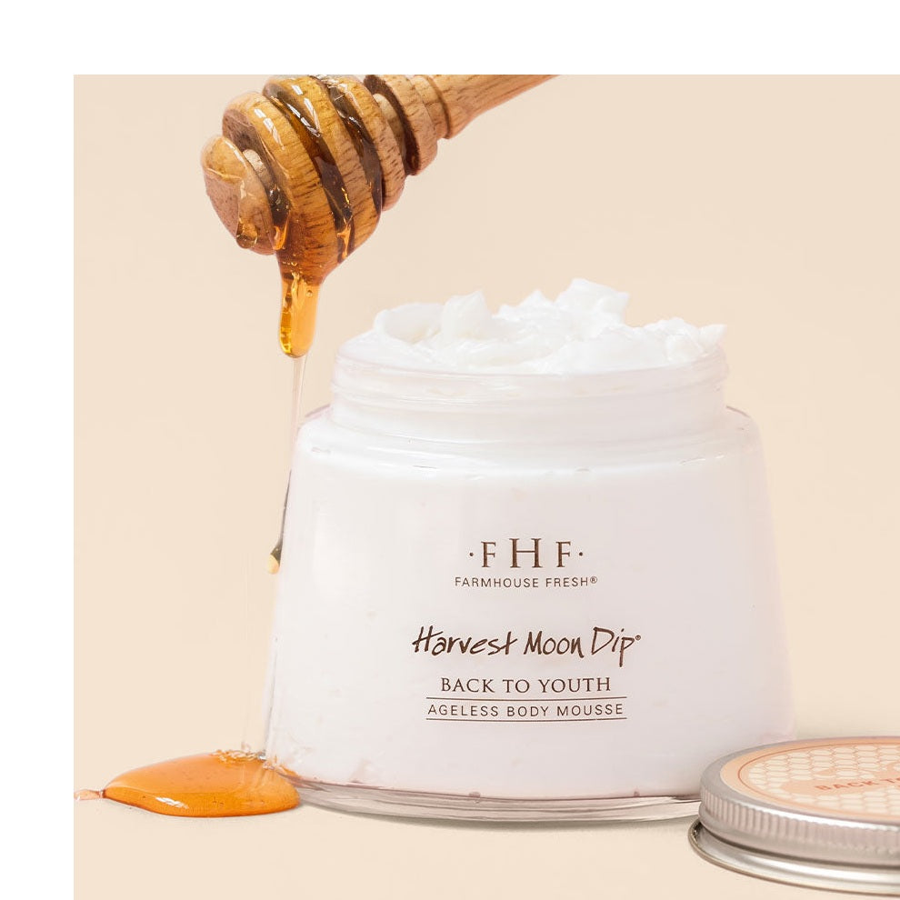 Harvest Moon Dip whipped body cream jar with honey dripping