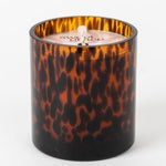 Candle with tortoiseshell pattern on a white background