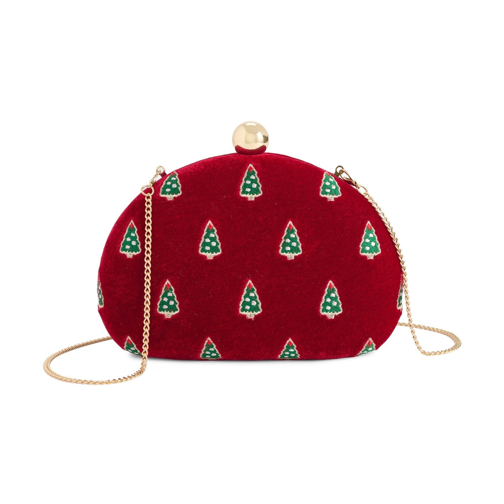 Embroidered red velvet clutch bag by Oscar de la Renta featuring a repeating motif of green Christmas trees, a polished gold-tone orb clasp, and a slender gold-link chain strap against a white background