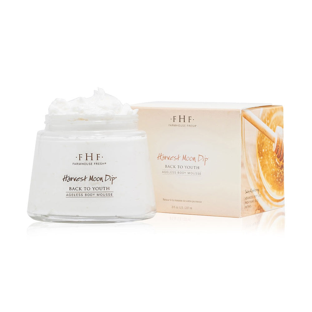 Harvest Moon Dip body cream jar beside its box
