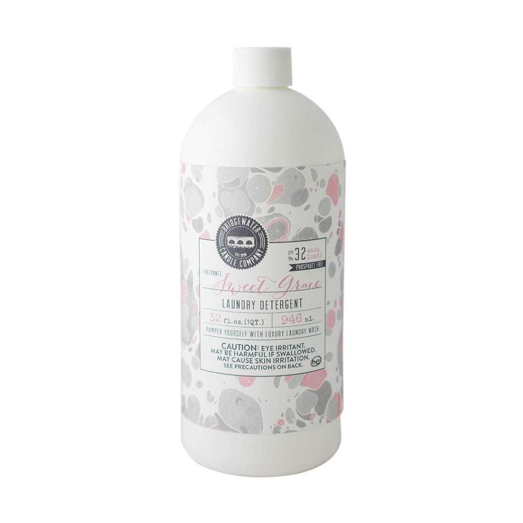 A bottle of Sweet Grace Laundry Detergent with a floral pattern on the label.