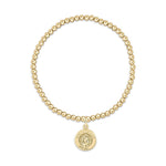 Gold beaded stretch bracelet with a round Saint Christopher pendant