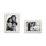 Two beaded acrylic picture frames with easel backs, one larger with a portrait of a family, and a smaller one beside it.